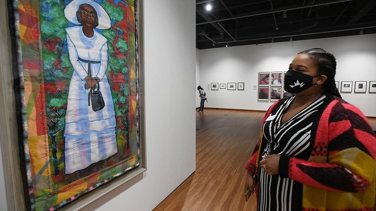 Tia Warren, Visitor Experience Associate and Docent Lead at the Harvey B. Gantt Center for African-American Arts + Culture talks about Faith Ringgold’s “Coming To Jones Road #3: Aunt Emmy, part of the “Vision & Spirit: African American Art” exhibit at the musuem.