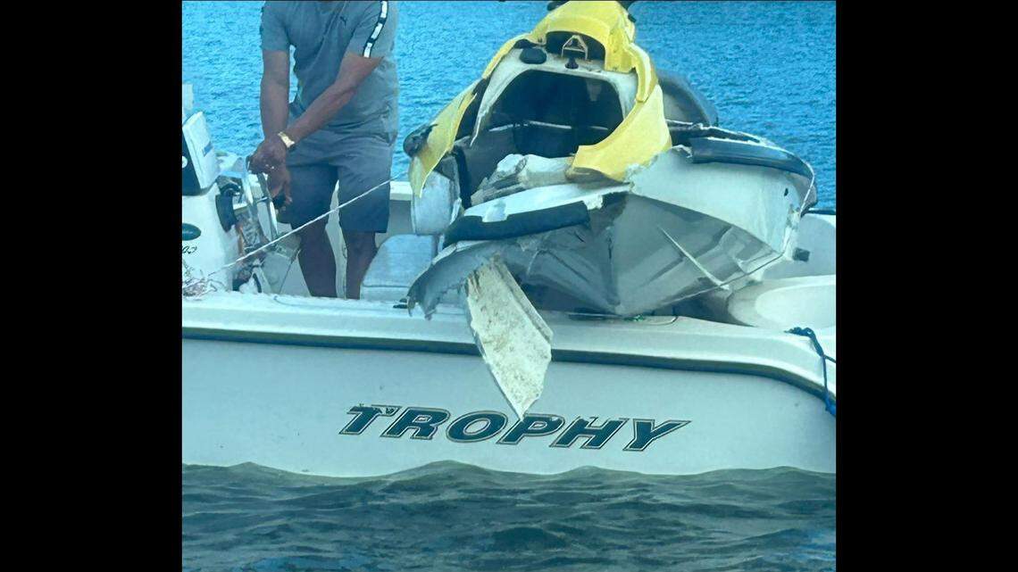 Rescuers pulled the damaged jet skis from Mountain Island Lake and brought them to shore.