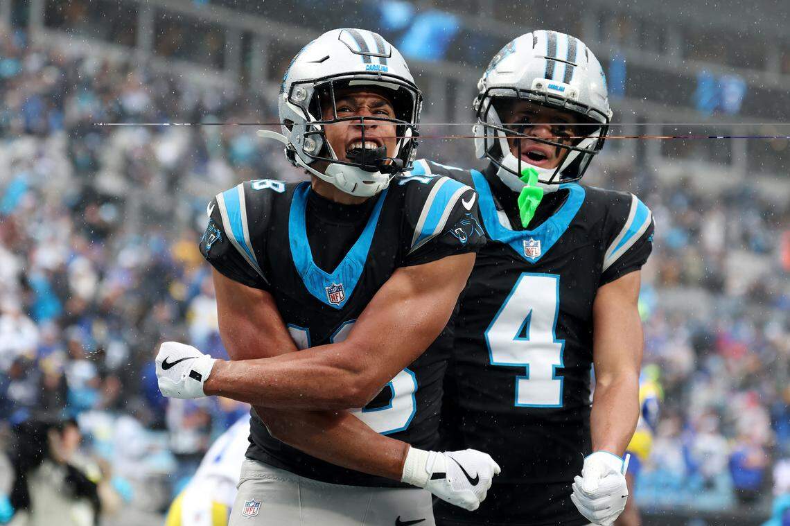 Carolina Panthers receiver Jalen Coker celebrates a touchdown with Tetairoa McMillan (4) during the third quarter of Sunday’s game against the Los Angeles Rams at Bank of America Stadium.