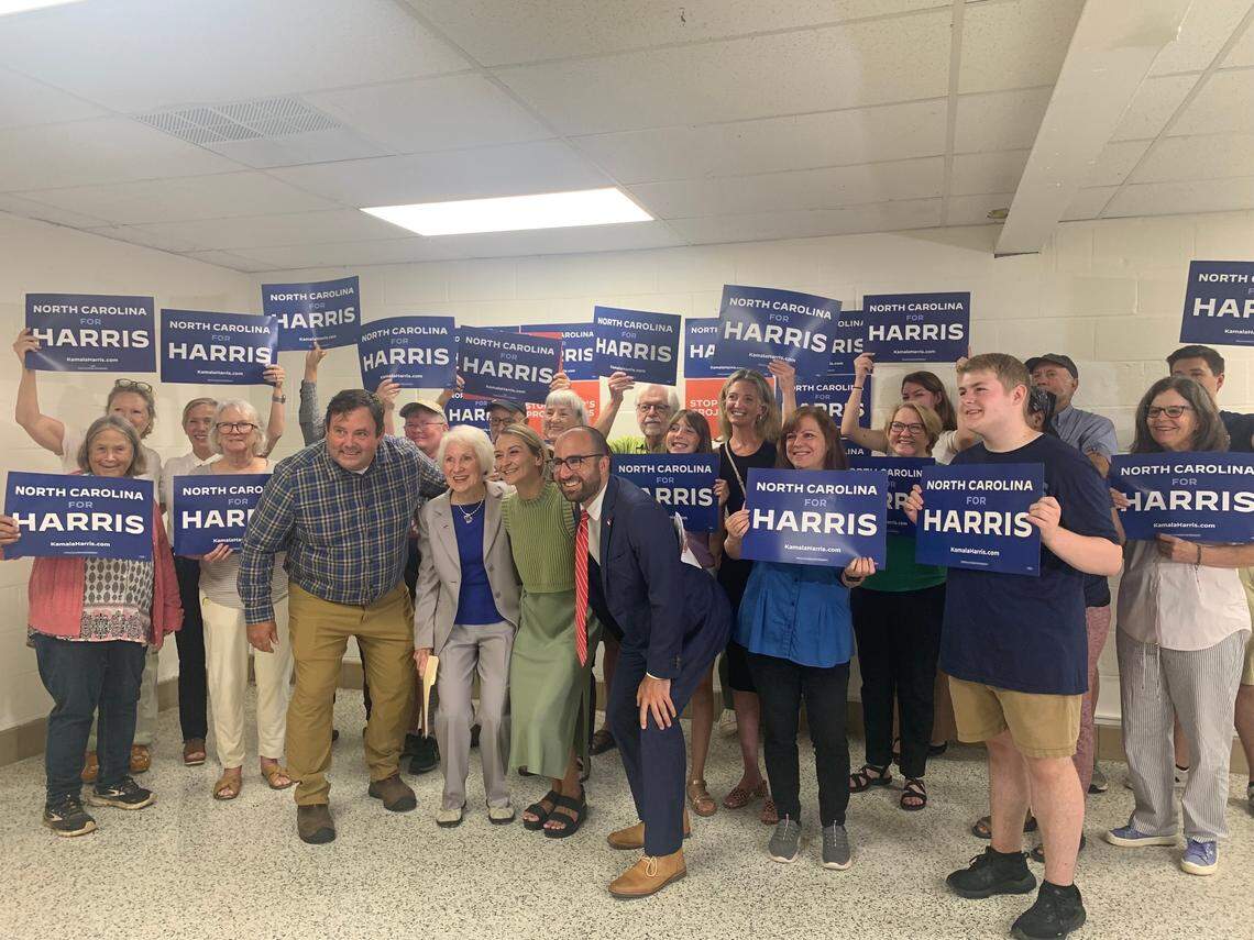 Kamala Harris supporters gather alongside North Carolina Democratic Party Chairwoman Anderson Clayton for a press conference at the Buncombe County Democratic headquaters ahead of Donald Trump’s Asheville rally.