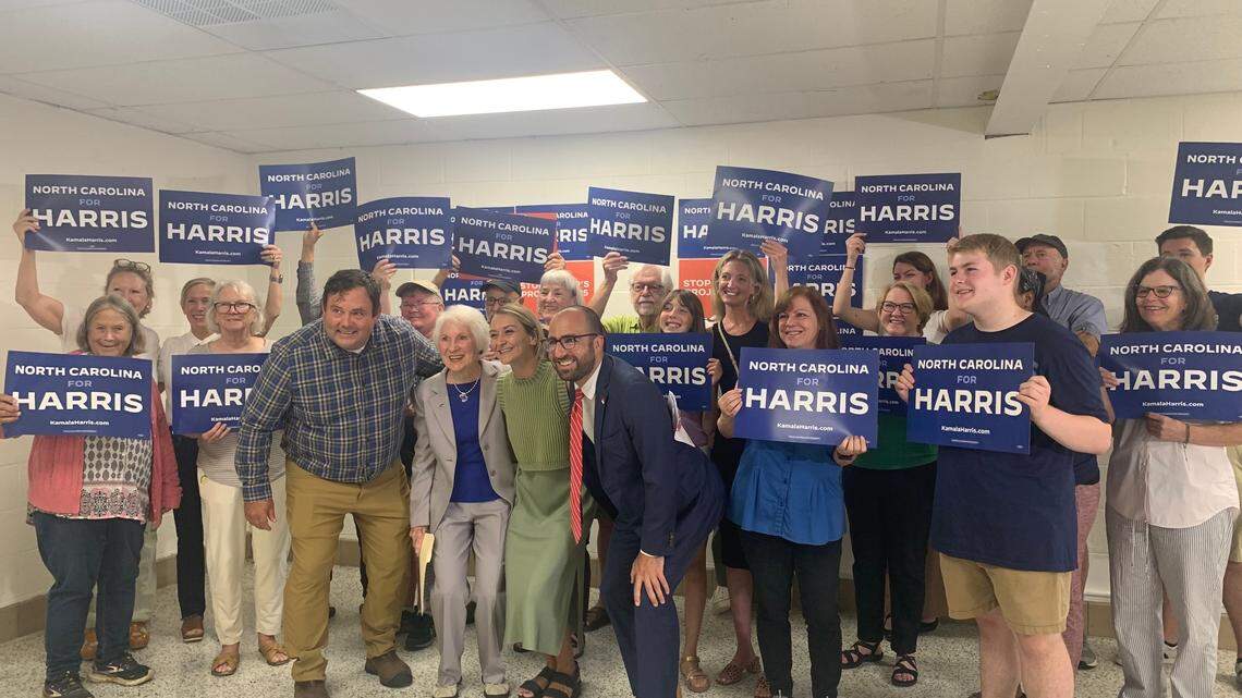 Kamala Harris supporters gather alongside North Carolina Democratic Party Chairwoman Anderson Clayton for a press conference at the Buncombe County Democratic headquaters ahead of Donald Trump’s Asheville rally.