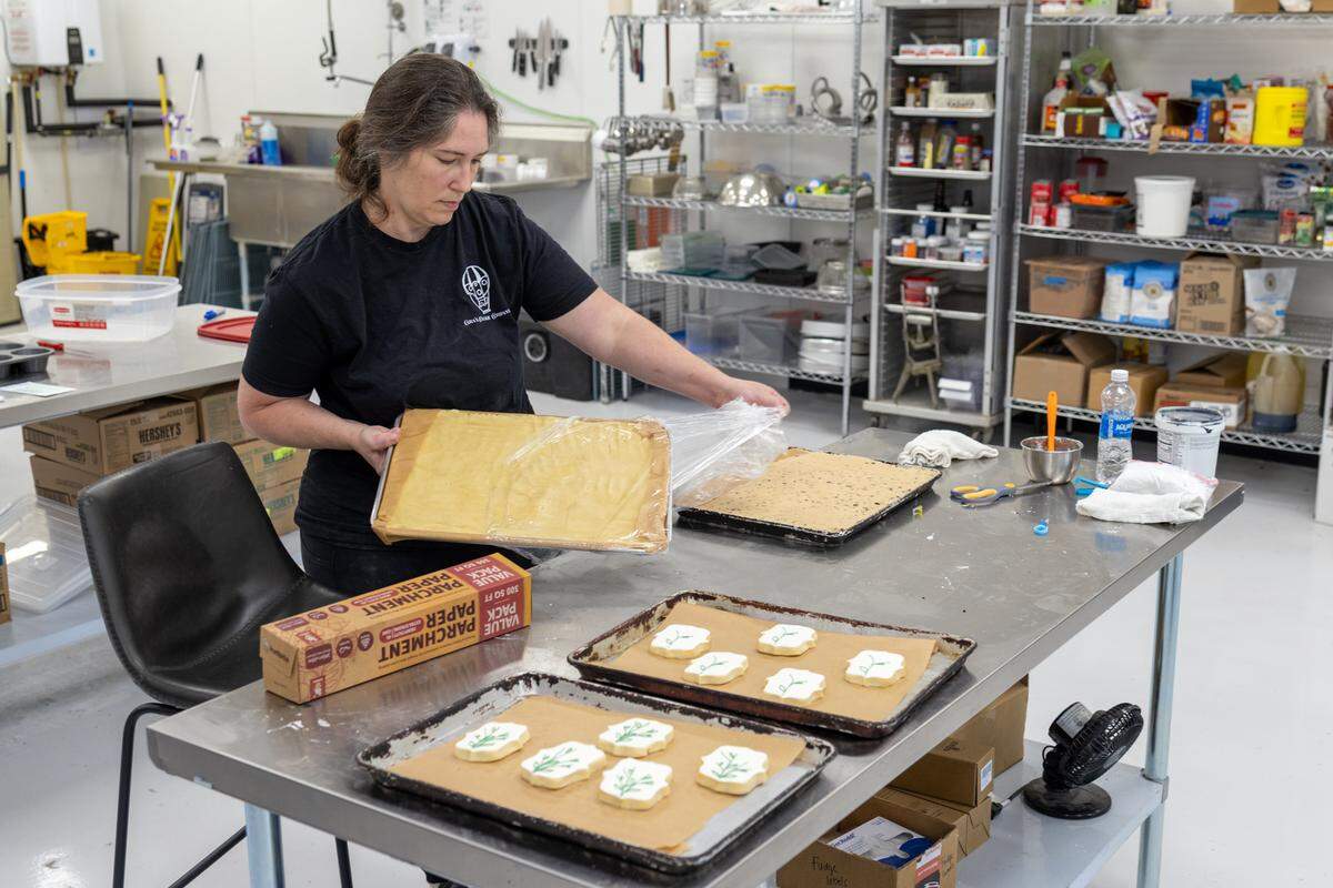 Jennifer Hamilton prepares cookies inside Cara’s Cookie Company.