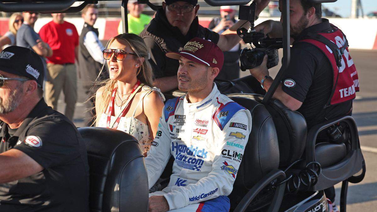 NASCAR Cup Series driver Kyle Larson, center, arrives at North Wilkesboro Speedway prior to the running of the NASCAR All-Star Race. Larson had earlier qualified fifth for the Indianapolis 500 on Sunday, May 19, 2024.