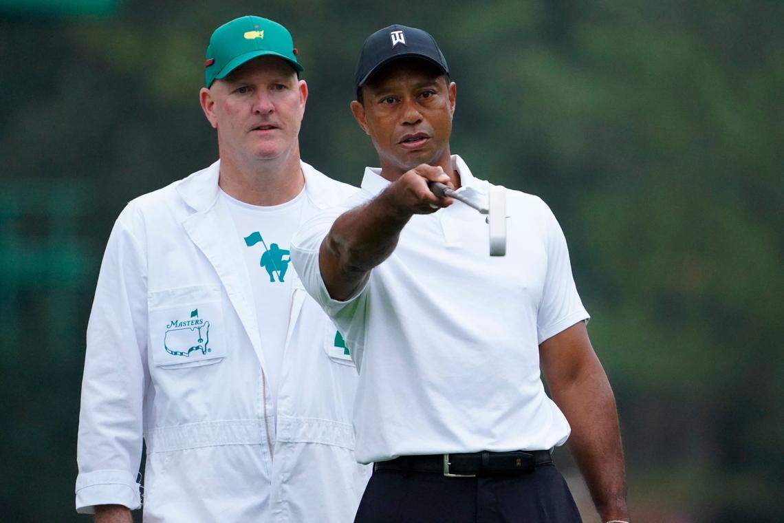 Tiger Woods (right) talks with caddie Joe LaCava during a practice round at Augusta National. LaCava, who now caddies for Patrick Cantlay, was Woods’ caddie for about a decade, including when Woods won the 2019 Masters.