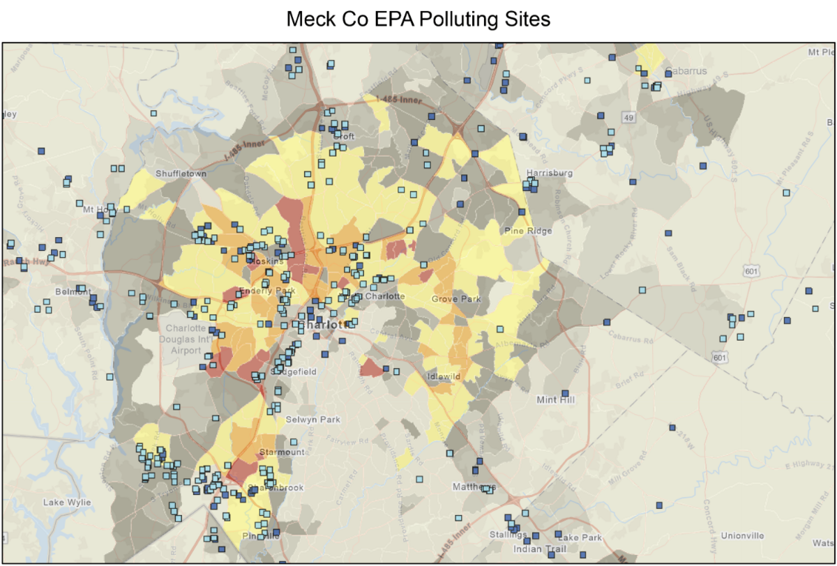 A map from CleanAIRE NC shows polluting facilities in Mecklenburg County. The sites are represented by blue dots and are primarily located in communities of color which are shaded in red and orange.