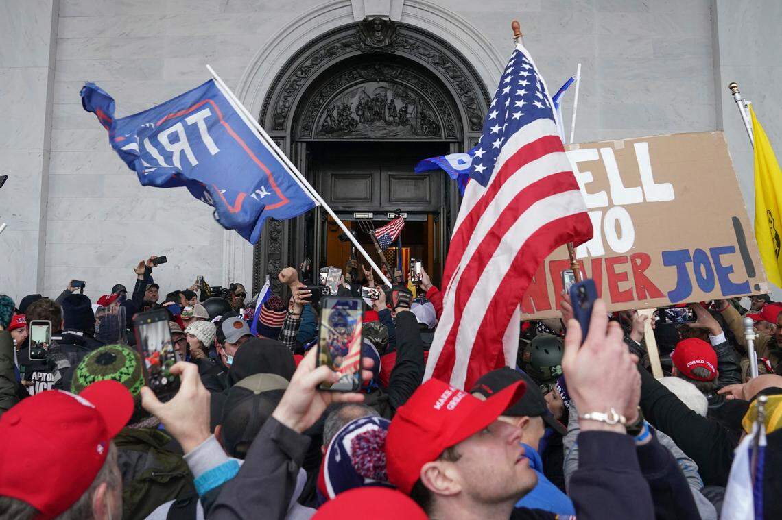 Rioters try to enter the U.S. Capitol on Jan. 6, 2021, in Washington. (AP Photo/John Minchillo)