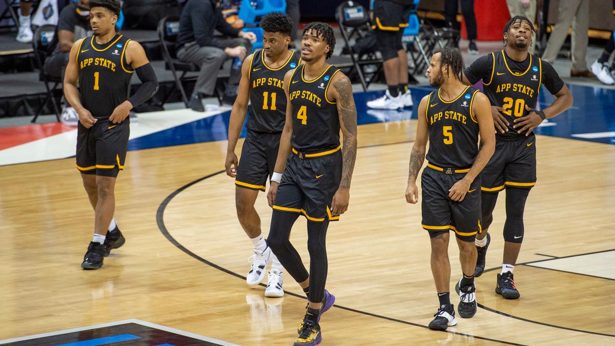 Appalachian State players walk back onto the court after a break in the first half of a First Four game in the NCAA men’s college basketball tournament, Thursday, March 18, 2021, in Bloomington, Ind.
