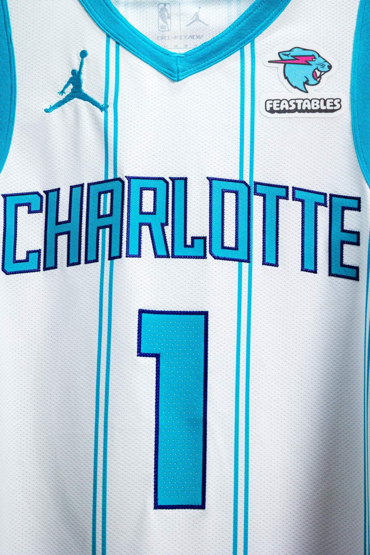 An image of the Charlotte Hornets’ jersey with their new patch sponsorship. The deal marks the first partnership between a creator-led brand and an NBA franchise.