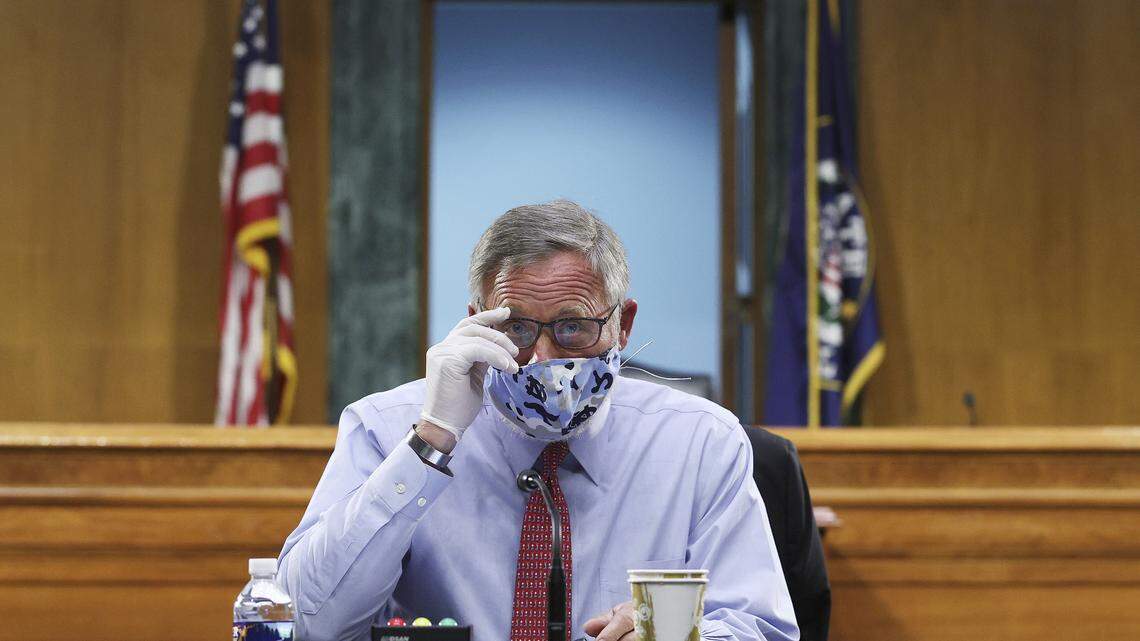 Sen. Richard Burr, R-N.C., arrives at a Senate Committee for Health, Education, Labor, and Pensions hearing, Tuesday, May 12, 2020 on Capitol Hill in Washington. Dr. Anthony Fauci, director of the National Institute of Allergy and Infectious Diseases, is to testify before the committee. (Win McNamee/Pool via AP)
