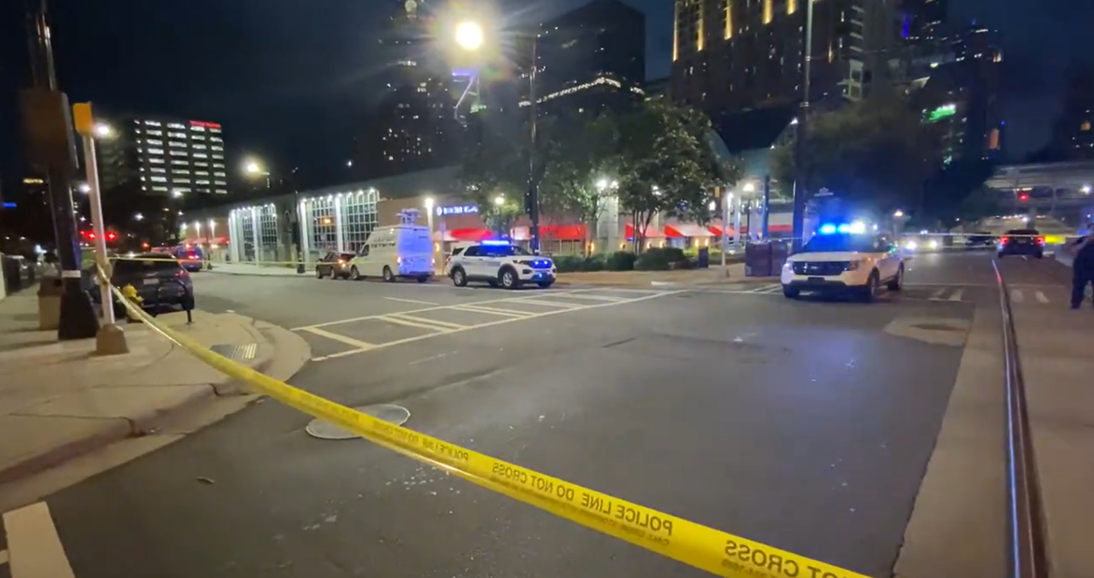 In this screenshot from WSOC video, police surround the Charlotte Transportation Center in uptown after a shooting killed one person and injured another on Friday, June 24, 2022.