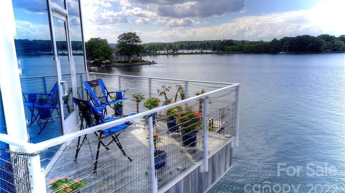 Lake Norman’s “mansion of glass” has sold for millions of dollars. The mansion has five balconies and many other features.