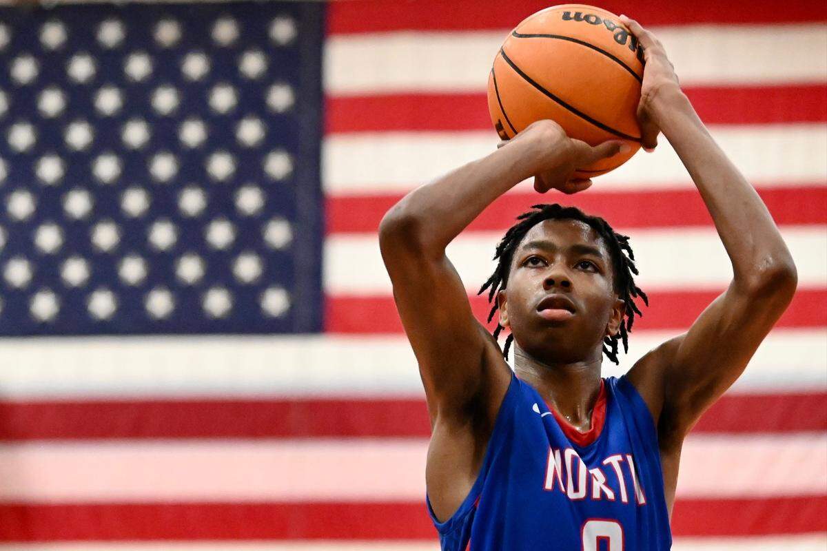 North Meck’s Isaiah Evans prepares to release a free throw after being fouled during overtime against Chambers High on Friday, January 6, 2023. Evans would later sink the game winning shot in the closing second to secure a 77-74 win. Jeff Siner/The Charlotte Observer