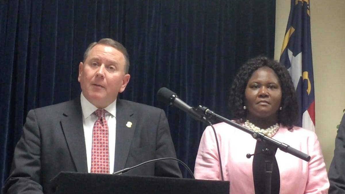In this 2019 photo, former U.S. Attorney for the Eastern District of North Carolina Robert Higdon and Biden nominee for U.S. Attorney for the Western District of North Carolina Dena King speak after jurors convicted two Raleigh gang members of murder and conspiracy.