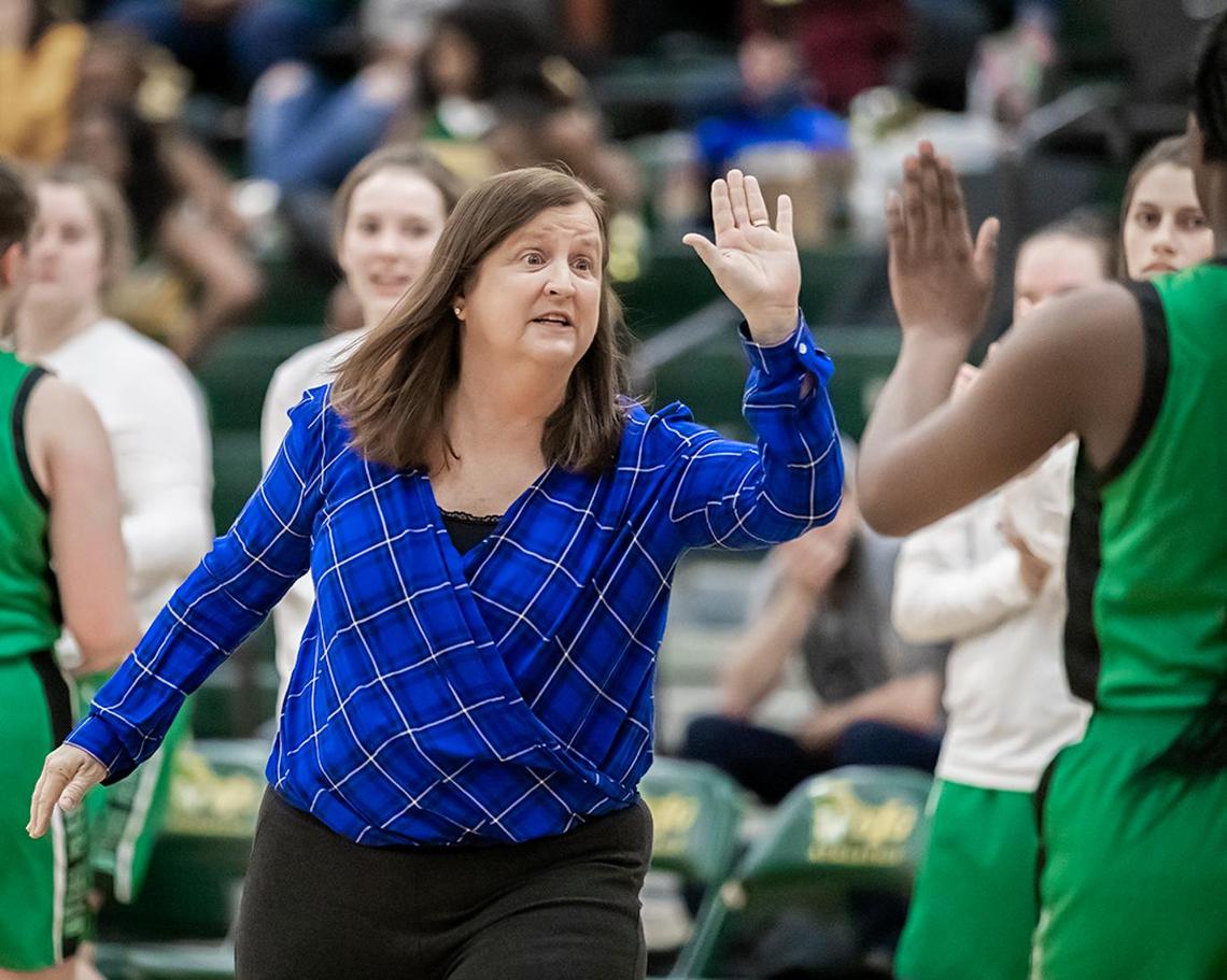 Myers Park Head Coach Barbara Nelson gathers her team for an early 1st quarter Patriot timeout.