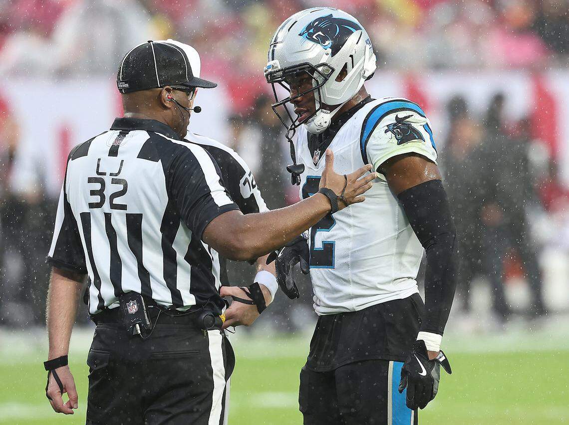 Carolina Panthers cornerback Mike Jackson, right, speaks with line judge Walter Flowers, left, following a series against the Tampa Bay Buccaneers at Raymond James Stadium in Tampa, FL. on Saturday, January 3, 2026. The Buccaneers defeated the Panthers 16-14.