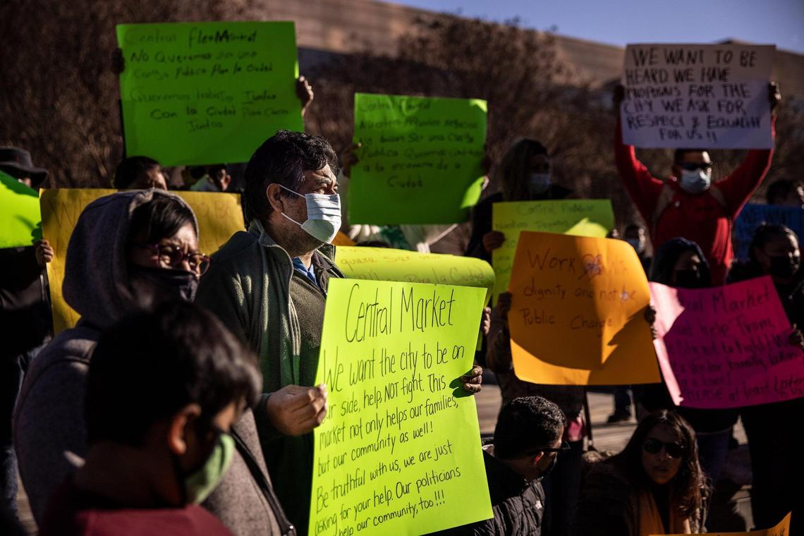 Carlos Aveilno, a vendor of the Central Flea Market, holds a sign during a press conference outside the Charlotte-Mecklenburg Government Center in uptown Monday afternoon. Many vendors have sold goods ranging from toothpaste to tacos on the site of the former Eastland Mall for years. But the city ended its lease with the market operator in the fall in anticipation of construction starting on a proposed mixed-use project.