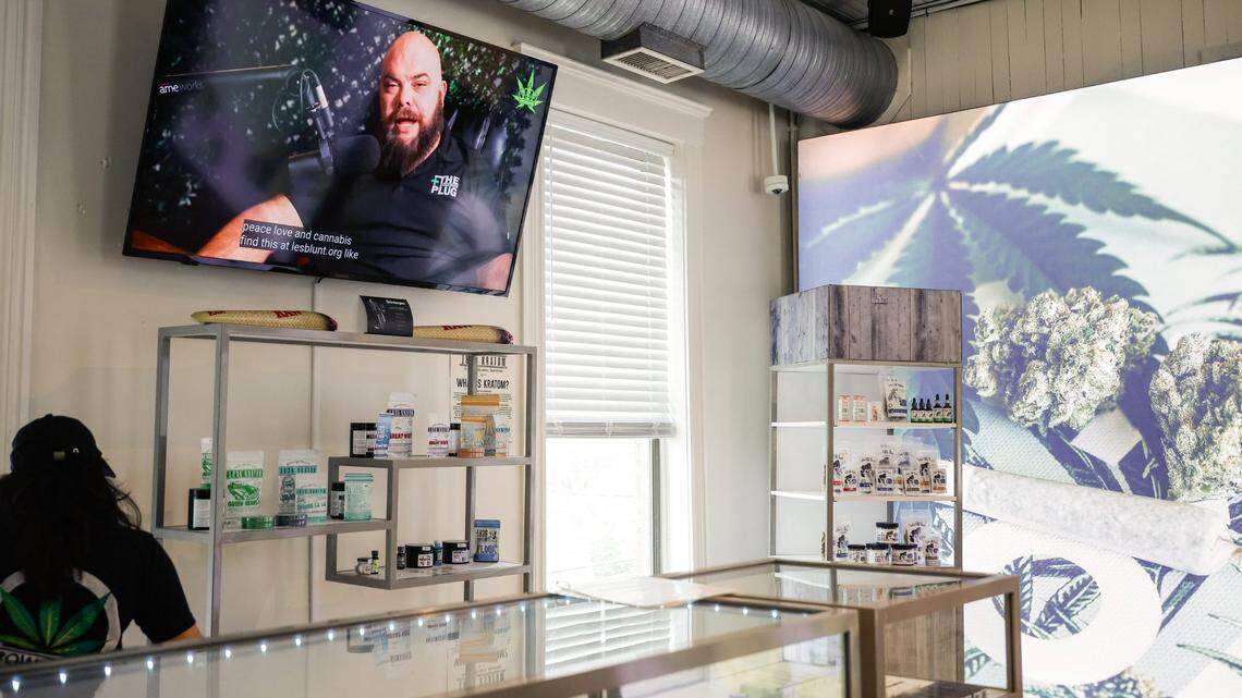A television monitor inside Crowntown Cannabis shows store owner, Michael Sims, as he hosts his own podcast, Let’s Be Blunt, on Tuesday, April 9, 2024
