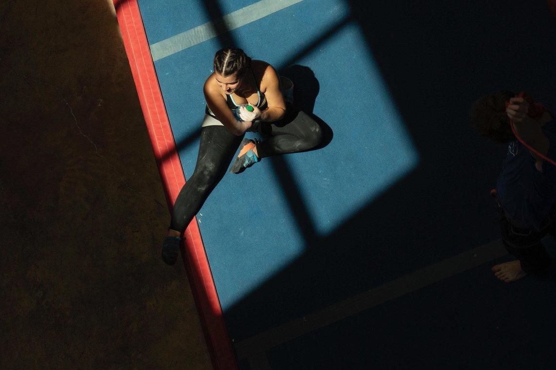 Giovanna Dubuc takes a break from training session last month at the Inner Peaks rock climbing gym in the South End area of Charlotte.