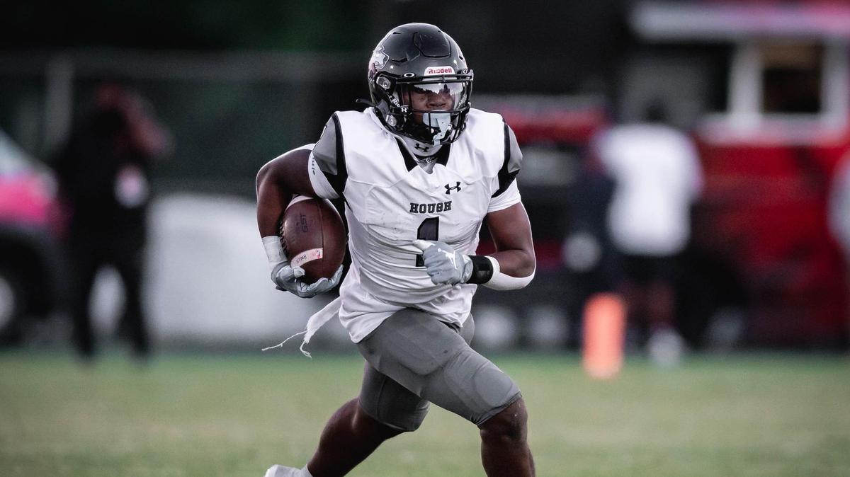 Huskie’s Jt Smith Jr gets the first down during early 1st quarter action. The Cougars would host the Hough Huskies Friday September 23, 2022.