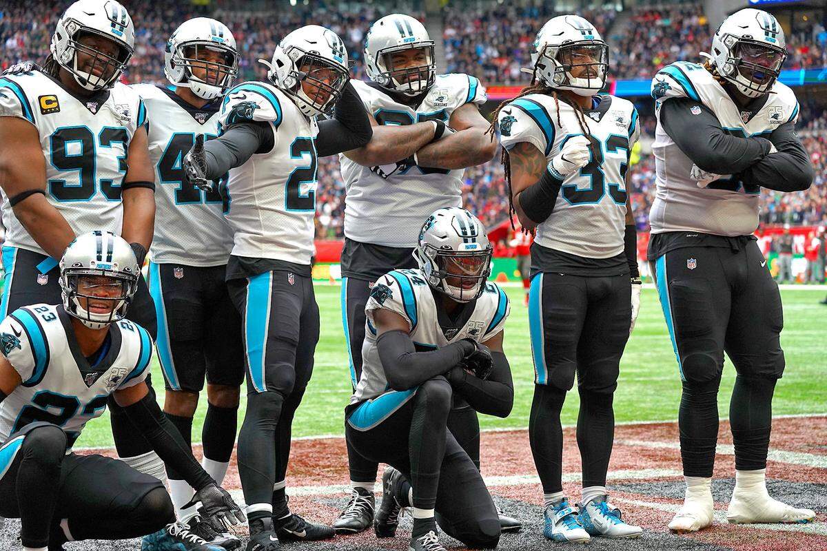 Carolina Panthers cornerback James Bradberry (center) celebrates one of his two interceptions Sunday along with his teammates. The Panthers defeated Tampa Bay, 37-26, for their fourth straight win.