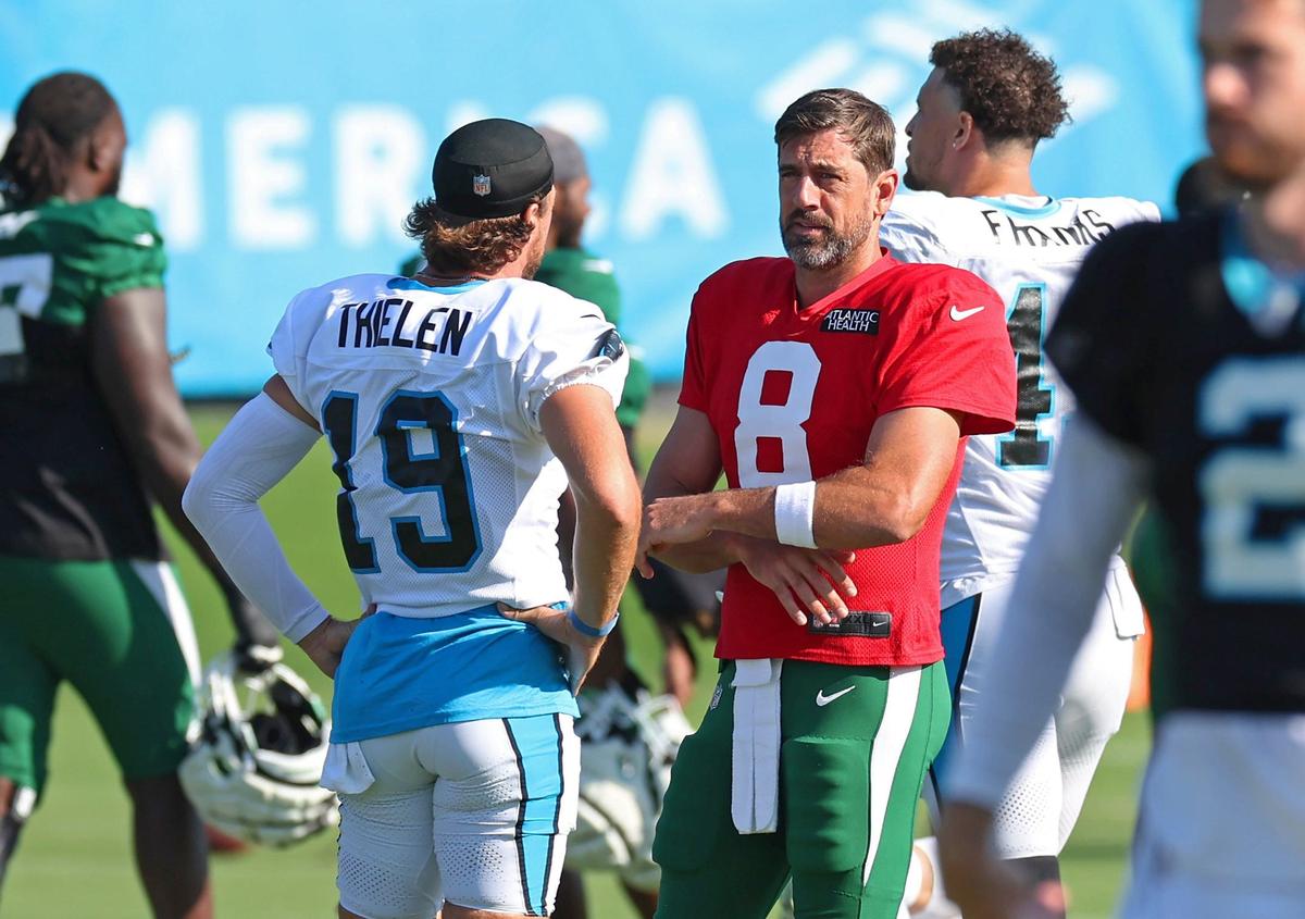 Carolina Panthers wide receiver Adam Thielen, left, talks with New York Jets quarterback Aaron Rodgers, right, prior to the team’s joint practice on Thursday, August 15, 2024 in Charlotte, NC.