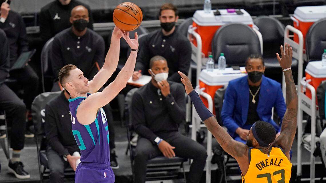 Charlotte Hornets forward Gordon Hayward, left, shoots as Utah Jazz forward Royce O’Neale (23) defends in the first half during an NBA basketball game Monday, Feb. 22, 2021, in Salt Lake City. (AP Photo/Rick Bowmer)
