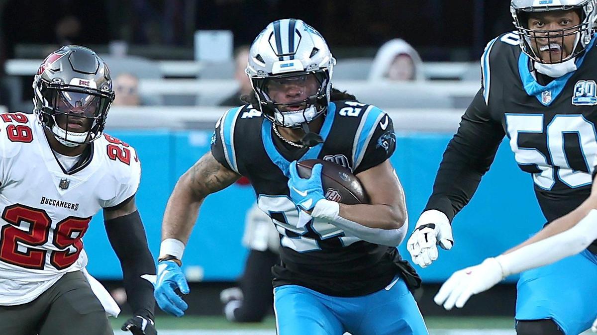 Carolina Panthers running back Jonathon Brooks, center, rushes for yardage as the Tampa Bay Buccaneers defense gives chase during action at Bank of America Stadium in Charlotte, NC on Sunday, December 1, 2024.