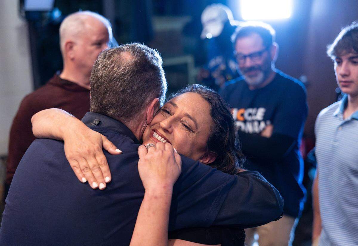 Nicole Sidman hugs her supporter during an election watch at Legion Brewing South Park in Charlotte Tuesday night, Nov. 5, 2024. GOP’s Tricia Cotham narrowly beats Sidman in NC House race