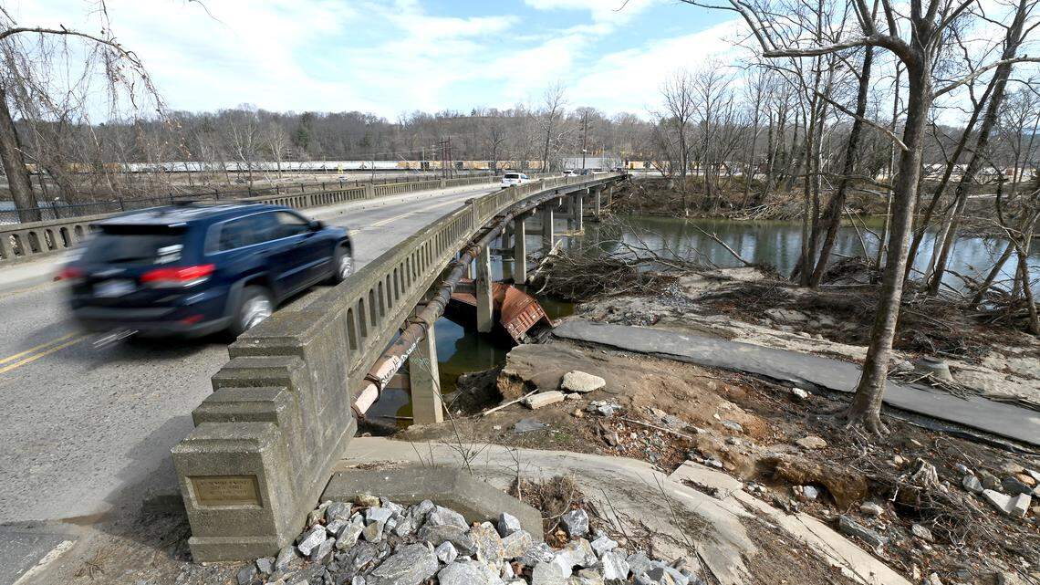 The city of Asheville changed its Helene’s recovery plan after the Department of Housing and Urban Development criticized its inclusion of “DEI criteria.” In this February file photo, traffic passes over the French Broad River in Asheville. Debris and the destroyed shoreline are still visible.