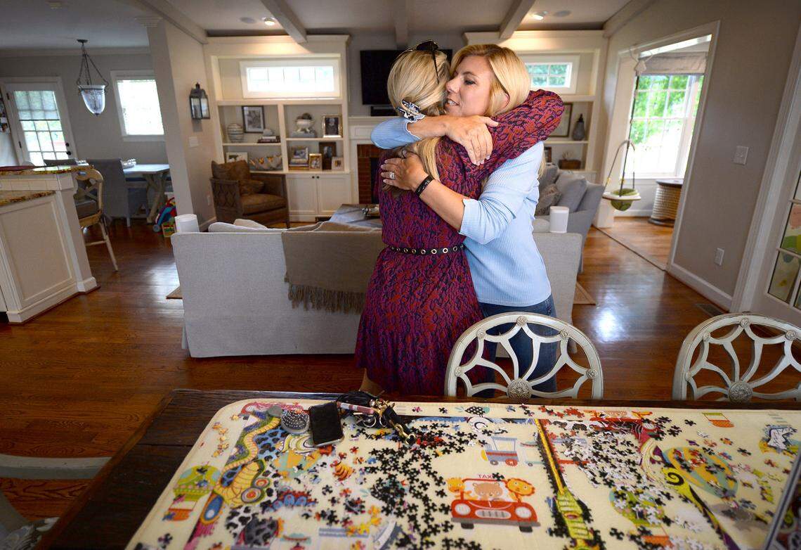 Morgan Fogarty, left and Molly Grantham share a hug last week as Fogarty arrived at Grantham’s home.