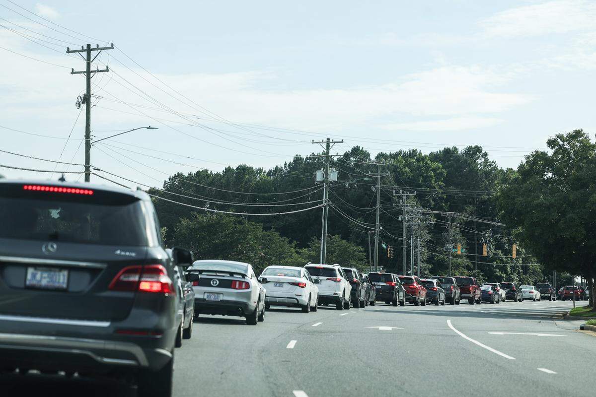 A line of traffic around the start of evening rush hour snakes along Mt. Holly-Huntersville Road in Charlotte. Due to an influx of development of housing and shopping centers, the amount of traffic along this two-lane road has become increasingly congested with traffic. 