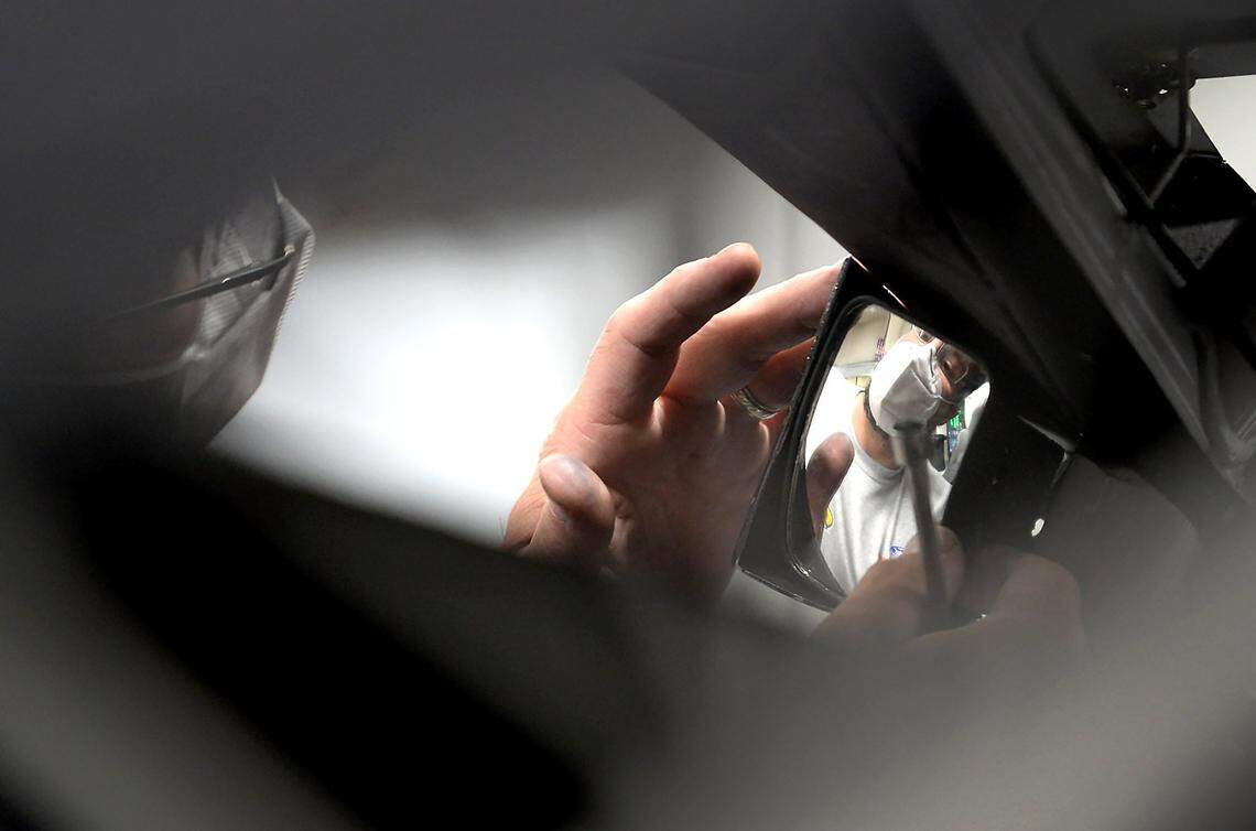 Bill Mares, the interior specialist for NASCAR driver Corey LaJoie’s No. 32 Ford Mustang for Go Fas Racing team adjusts a mirror on a car on Tuesday, May 5, 2020. The team is preparing for the first race at Darlington Raceway in Darlington, SC on Sunday, May 17, 2020.