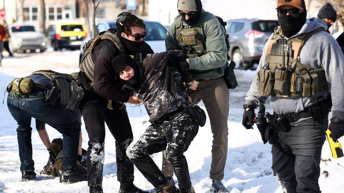 Federal agents detain a protester in Minneapolis, Minnesota on February 3, 2026. A US judge on January 31, 2026 denied Minnesota's bid to force Immigration and Customs Enforcement (ICE) to suspend its sweeping detention and deportation operation in the state that has left two US citizens dead and fueled massive protests. Masked and heavily armed federal agents have swept through Minnesota communities seeking undocumented migrants, detaining thousands and shooting dead two US citizens in the process. (Photo by Charly TRIBALLEAU / AFP via Getty Images)