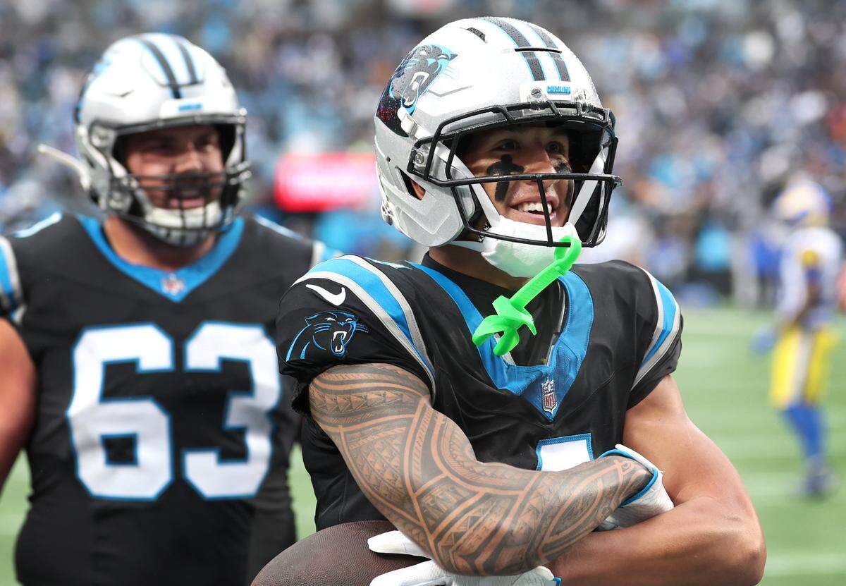 Carolina Panthers wide receiver Tetairoa McMillan strikes a pose in the end zone after catching a touchdown pass from quarterback Bryce Young during fourth quarter action against the Los Angeles Rams at Bank of America Stadium in Charlotte, NC on Sunday, November 30, 2025. The Panthers defeated the Rams 31-28.