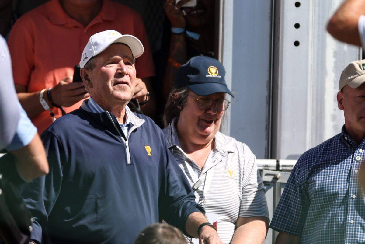 Former President George Bush watches the second round of the Presidents Cup at Quail Hollow Golf Club in Charlotte, N.C., on Friday, September 23, 2022.