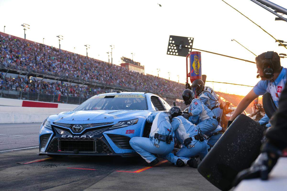 NASCAR Cup Series driver Tyler Reddick (45) gets service on pit road during the NASCAR Cook Out Southern 500 at Darlington Raceway.