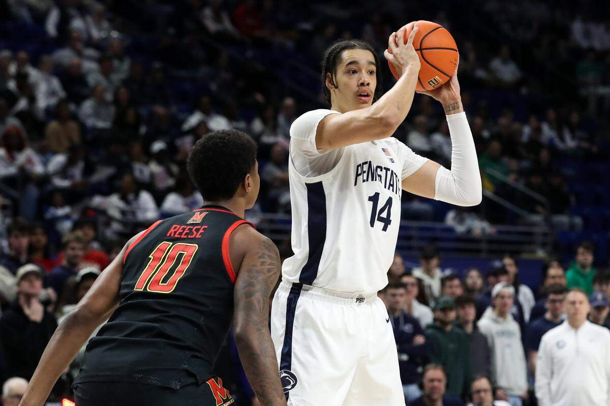 Penn State Nittany Lions forward Yanic Konan Niederhauser (14) looks to pass the ball as Maryland Terrapins forward Julian Reese (10) defends during the first half at Bryce Jordan Center.