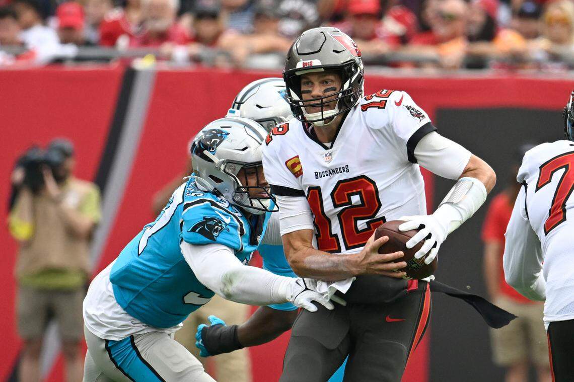 Tampa Bay Buccaneers quarterback Tom Brady is sacked by Carolina Panthers defensive end Yetur Gross-Matos during the first half of an NFL football game between the Carolina Panthers and the Tampa Bay Buccaneers on Sunday, Jan. 1, 2023, in Tampa, Fla. (AP Photo/Jason Behnken)