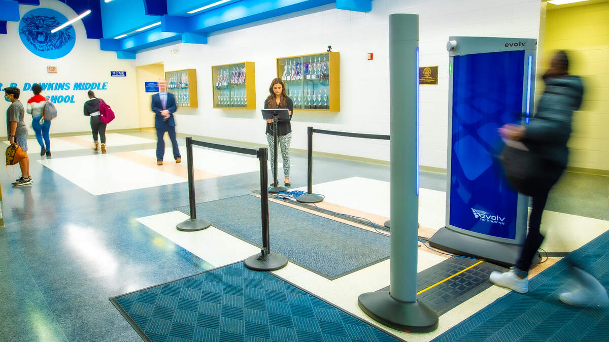 A students walks through the body scanner at R.P. Dawkins Middle School in Spartanburg, S.C. CMS officials consulted the Spartanburg district before implementing their own scanners.