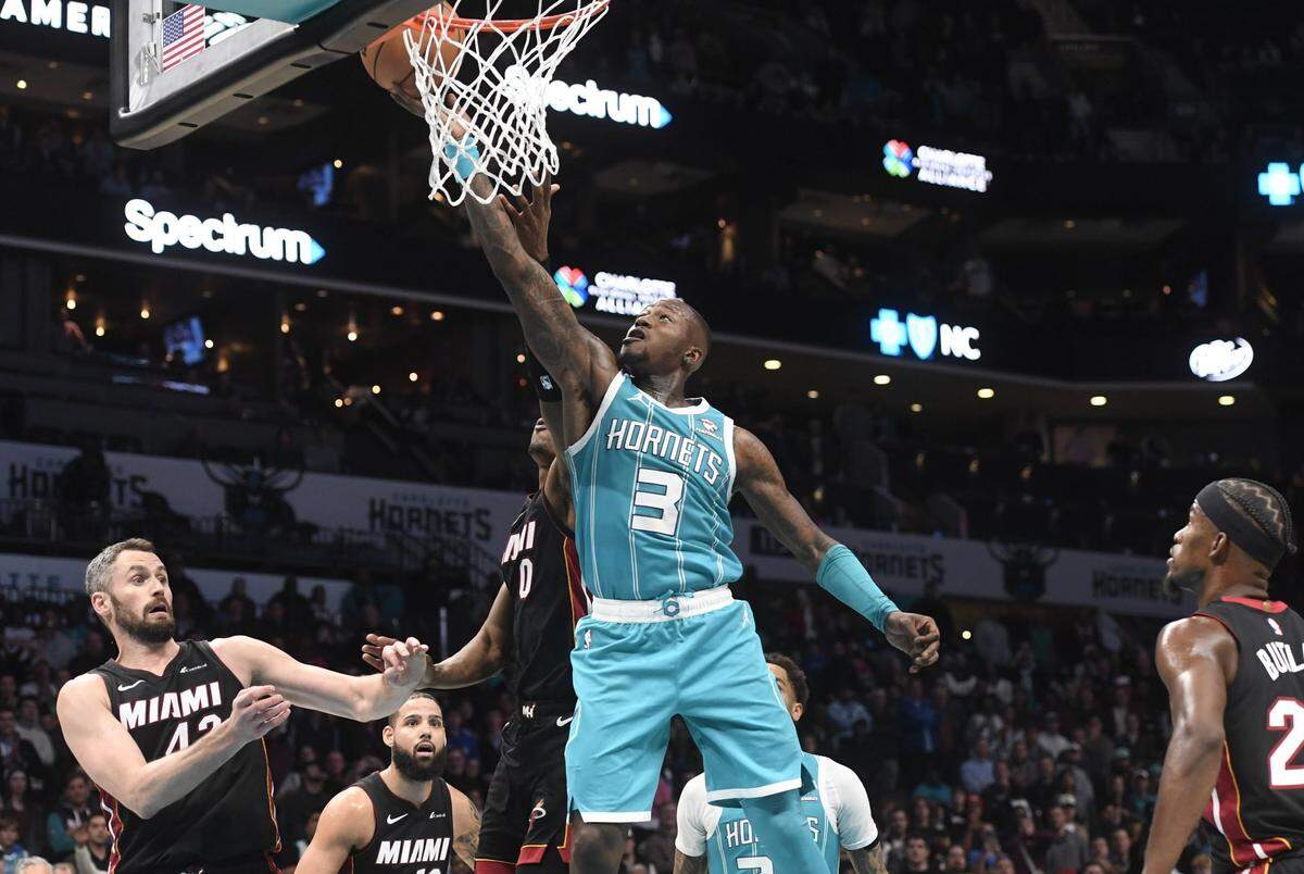 Charlotte Hornets guard Terry Rozier (3) drives in after getting his own rebound on a missed foul shot during the second half against the Miami Heat at the Spectrum Center.