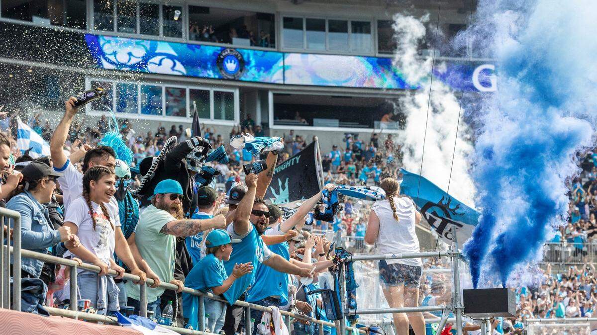Fans celebrate a the scoring of a second goal, securing a win over the New York Red Bulls, during the game at Bank of America Stadium on Saturday, June 11, 2022 in Charlotte, NC.