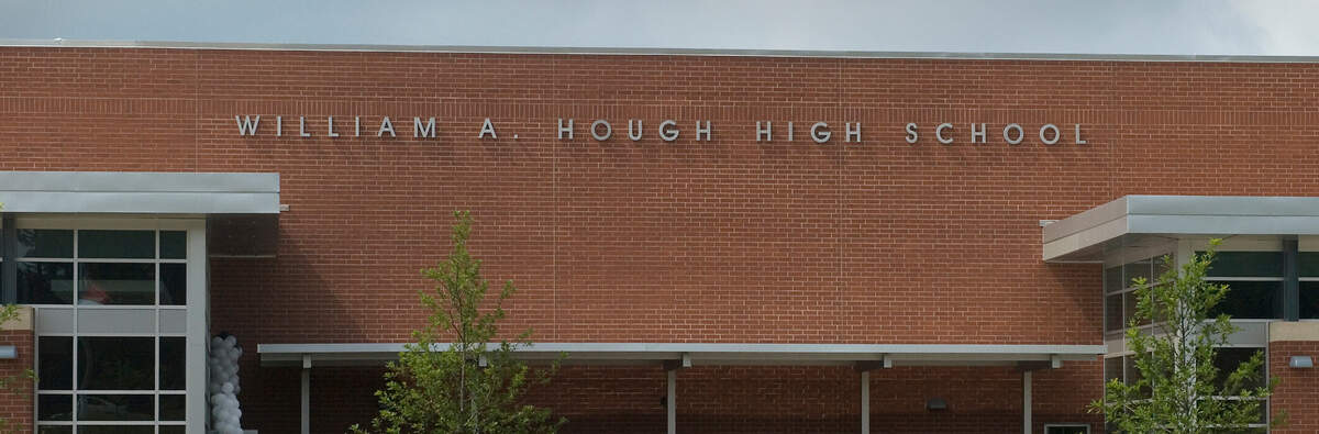 8-14-2010 Parents and students gather outside of William A. Hough High School for the unveiling of the new school. ERIN SMITH - erinsmith@charlotteobserver.com