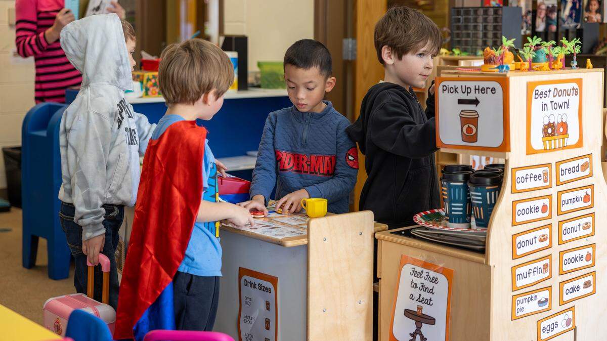 Cabarrus County Schools students play in a mock-up coffee shop in their classroom.