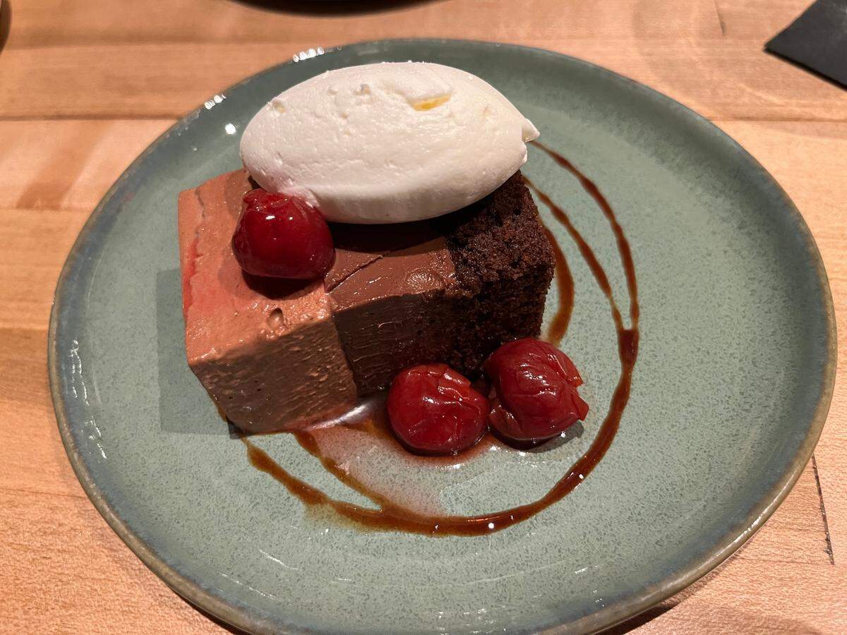 Napa’s Milk Chocolate Mousse Cake blends chocolate genoise, dark chocolate crémeux and milk chocolate mousse, with a black cherry compote and chantilly cream.