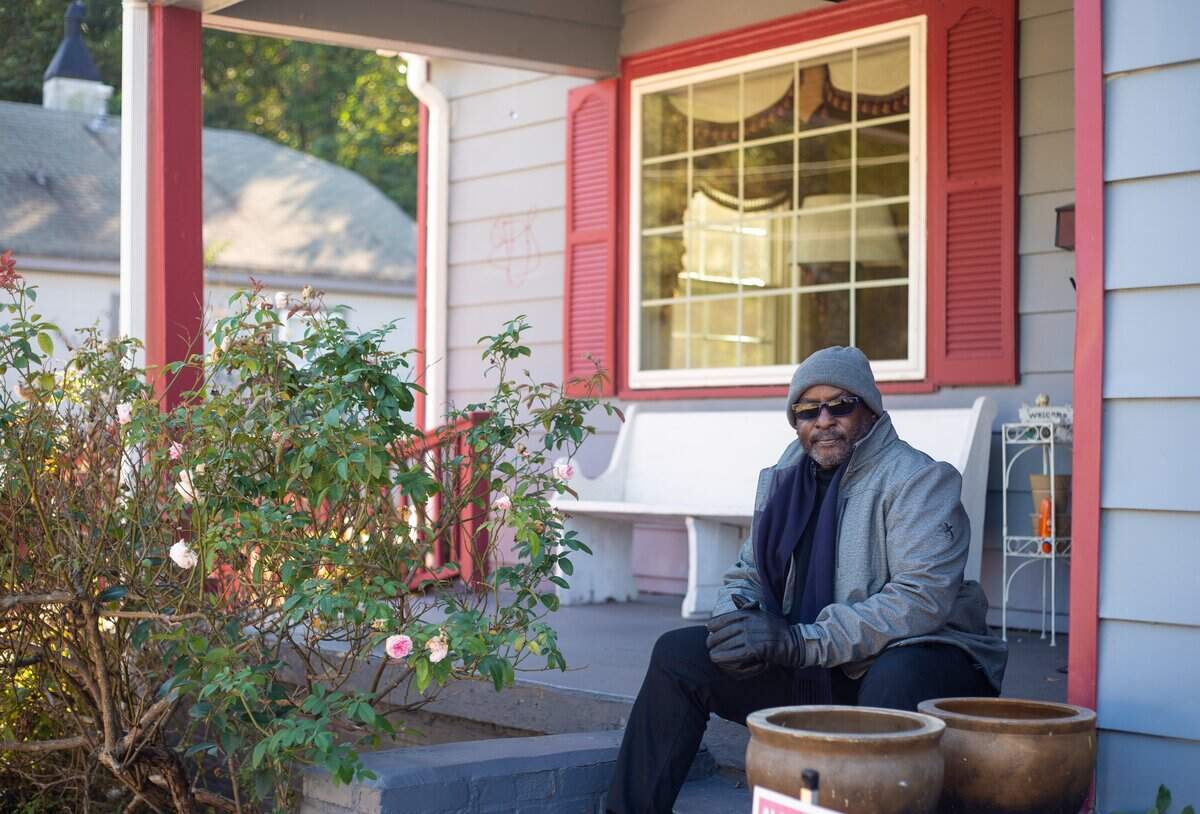 Darryl Gaston sits for a portrait in front of his home in Druid Hills. Druid Hills and much of North Charlotte has already seen rapid development because of proximity to Uptown, and community leaders like Gaston fear the opportunity zone program could further accelerate the displacement of long-time residents.