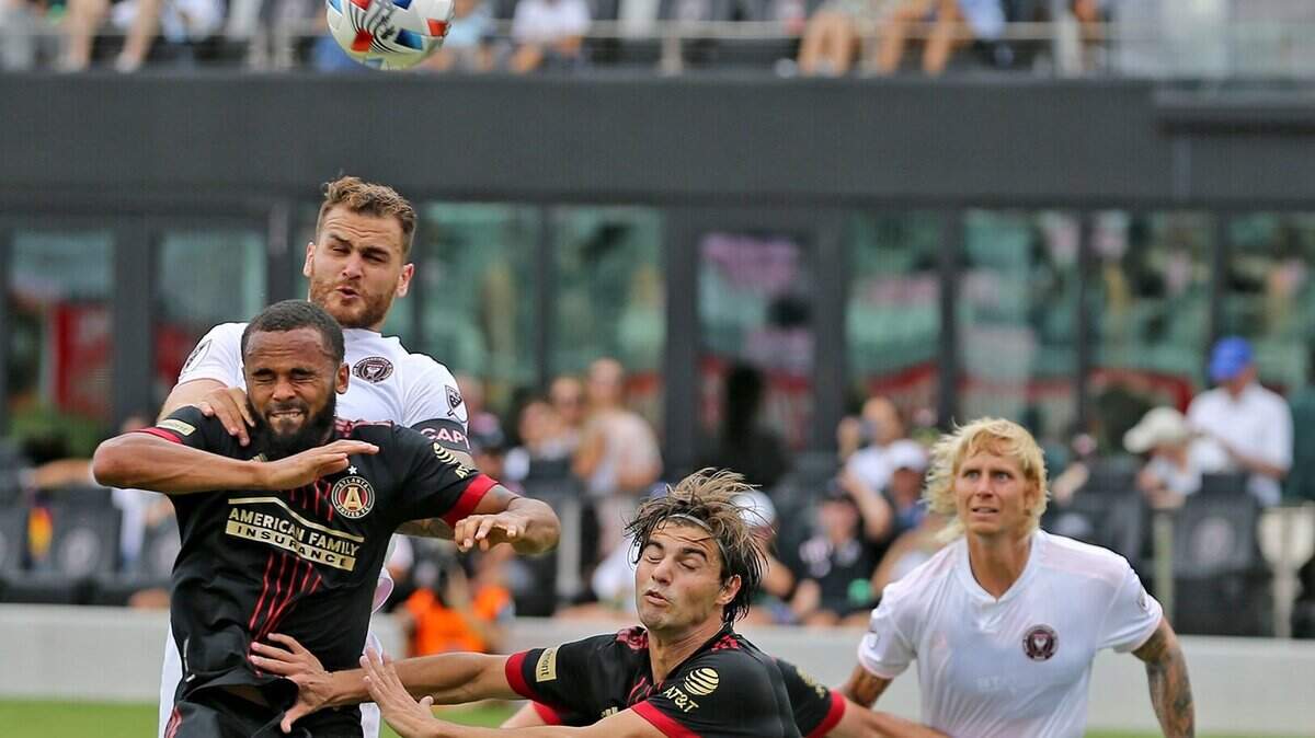 Atlanta United’s Anton Walkes (left, black jersey) was selected by Charlotte FC in the MLS expansion draft on Tuesday night.
