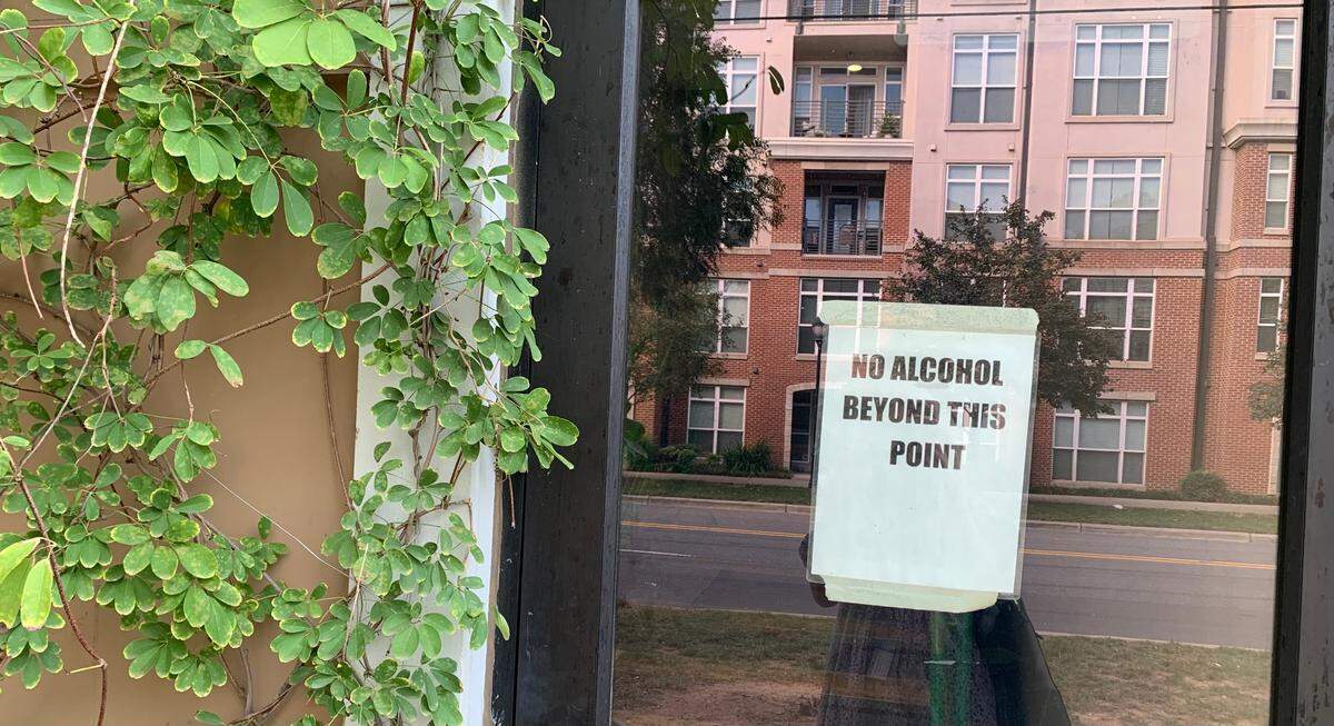 A sign reads “No alcohol beyond this point” on a door at the Charlotte Beer Garden in South End Charlotte.