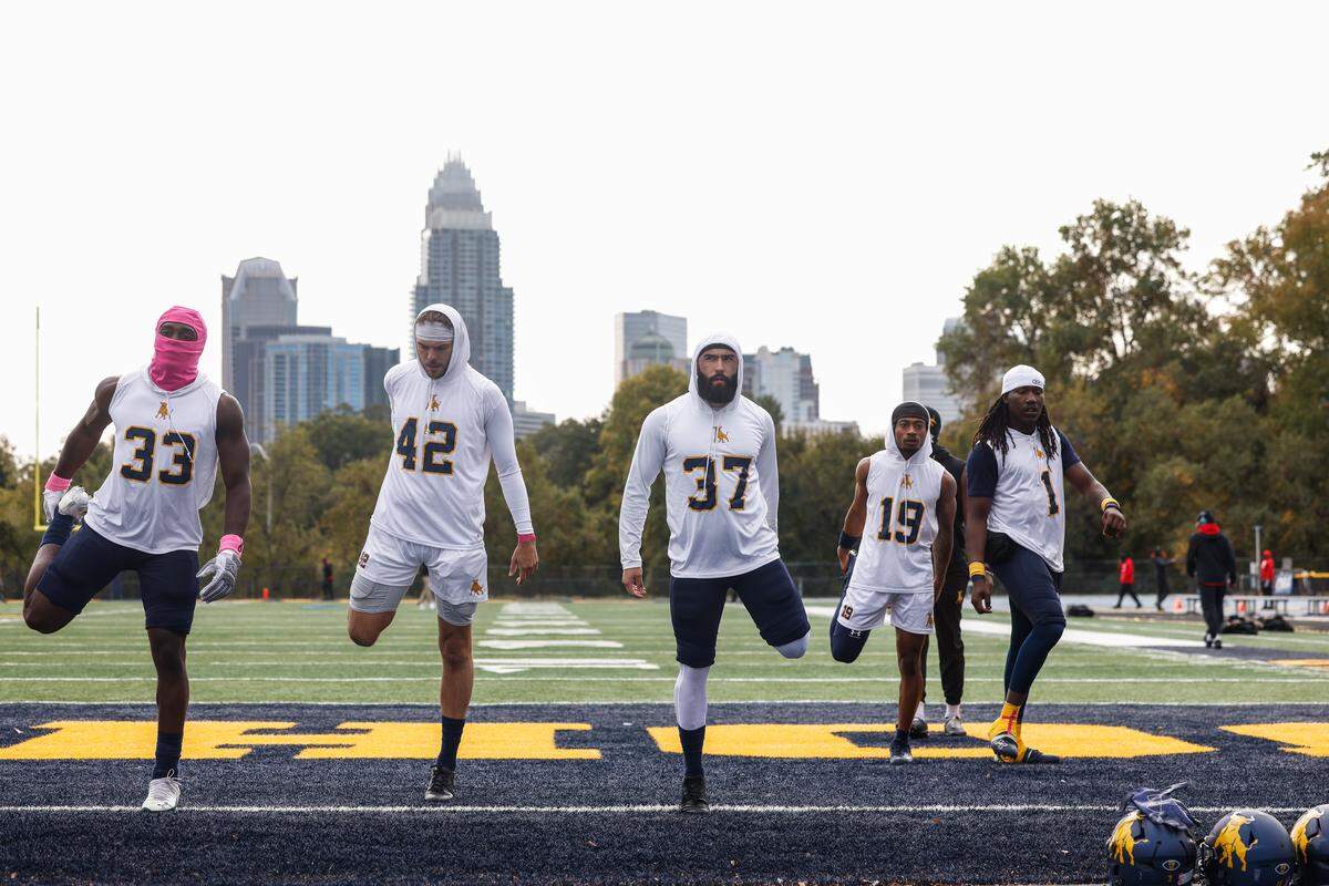 Andrew Hirst, second from left, and Lukasz Smolen, center, warm up with teammates ahead of JCSU’s Oct. 25, 2025, game against Winston-Salem State at Eddie C. McGirt Field in Charlotte.