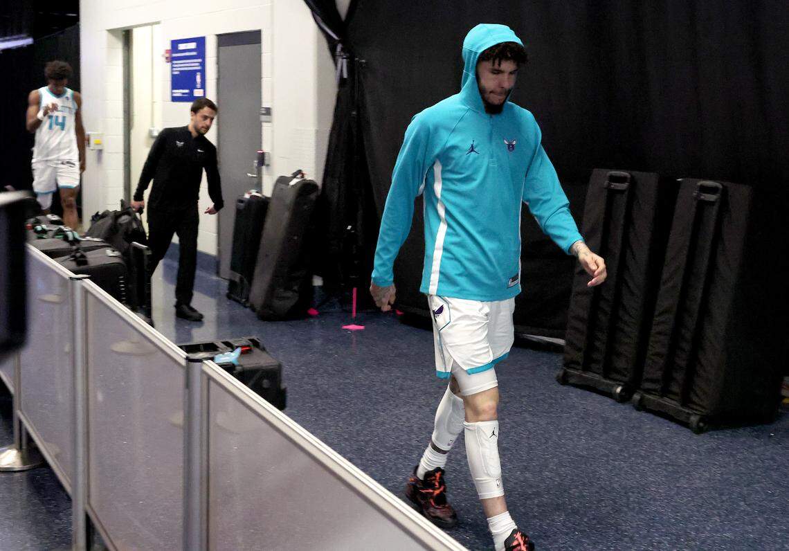 Charlotte Hornets guard LaMelo Ball walks to the team’s locker room following a 121-90 loss to the Orlando Magic at Kia Center in Orlando, Florida on April 17.