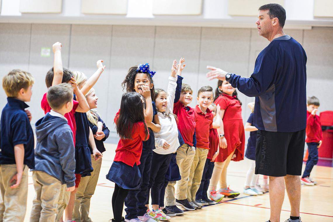 Jamie Seitz (right) was a coach and an elementary school PE teacher for Lincoln Charter School in Denver, N.C., since 2009. Seitz died on Dec. 27, 2020, due to COVID-19. He was 51.